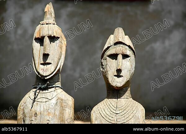 Two heads of ancient wooden totem figures museum Konso Ethiopia.