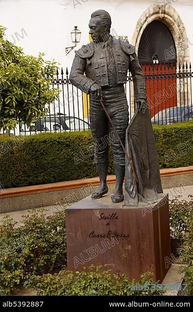 Statue of torero Curro Romero, Francisco Romero LÃ³pez in front of a bullfighting arena, bullring in Seville, Andalusia, Spain, Europe.