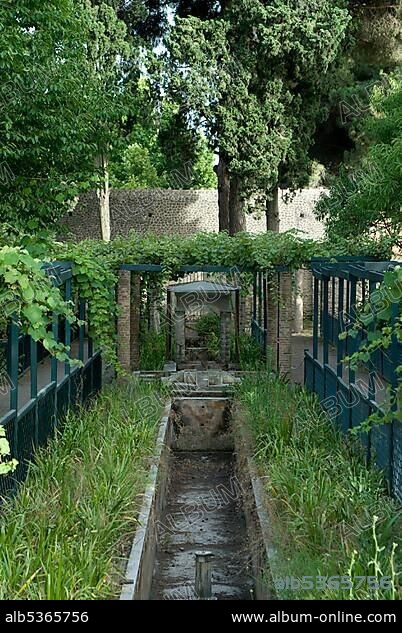 Small runnel flowing through the garden at the House of Octavius Quartio (aka House of Loreius Tiburtinus), excavations at Pompeii, Roman archaeological site, Naples, Campania, Italy, Europe.