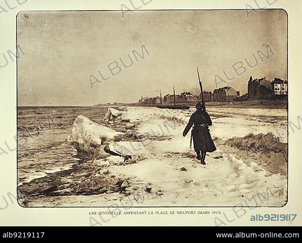 Soldier on patrol along the beach in winter at Nieuwpoort in Flanders during the First World War, Belgium, Europe.