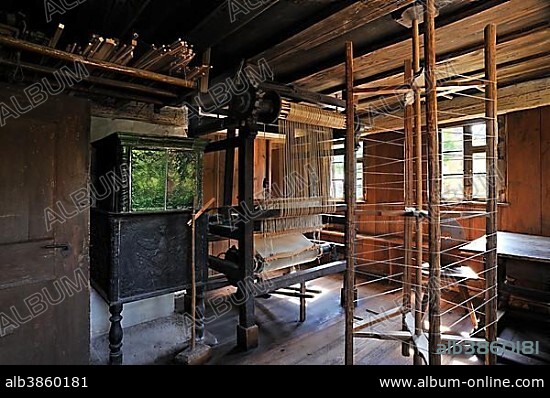 Old loom, displayed in the Köblerhaus, a smallholder's farmstead, originally from Oberfelden, relocated to the Franconian Open Air Museum in Bad Windsheim, Middle Franconia, Bavaria, Germany, Europe.