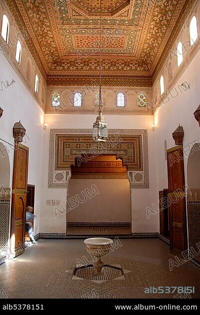 Fine designed oriental interior paintings at wooden ceiling Palais de la Bahia Marrakech Morocco.