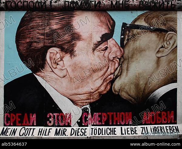 Graffiti brotherly kiss between Leonid Brezhnev and Erich Honecker, artist Dimitrij Vrubel, East Side Gallery, Berlin, Germany, Europe.