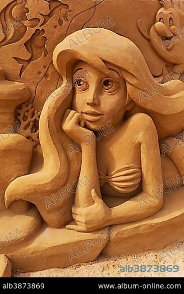 Woman with long hair, sand sculpture, mermaid from the Disney cartoon Arielle sand sculptures festival Frozen Summer Sun, Oostende, West Flanders, Belgium, Europe.