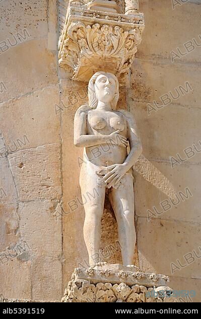 Romanesque portal with a statue representing Eve on the Cathedral of St. James in Sibenik, Croatia, Europe.