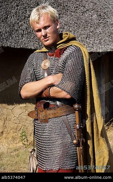 Man with roman chain mail, outdoor museum "Hjemsted Oldtidspark", Skaerbaek, South Jutland, Denmark, Europe.