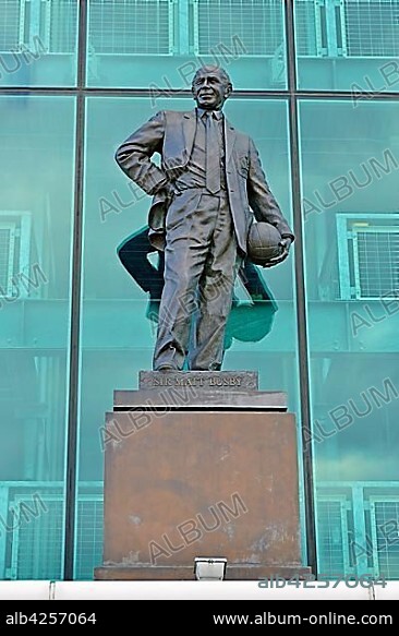 Sir Matt Busby statue outside Old Trafford, former english football coach, home of Manchester United football club, England, United Kingdom, Europe.