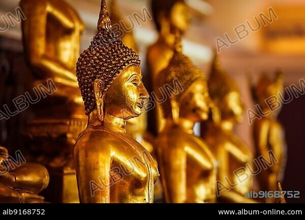 Golden Buddha statues in buddhist temple Wat Saket (The Golden Mount), Bangkok, Thailand, Asia.