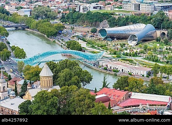 Peace Bridge over the Mtkvari river, Presidential Palace, Concert Hall and Exhibition Centre, Rike Park, Tbilisi, Georgia, Asia.