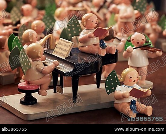 Handmade wooden angels playing musical instruments as a table decoration from the Erzgebirge or Ore Mountains, Germany, Europe.