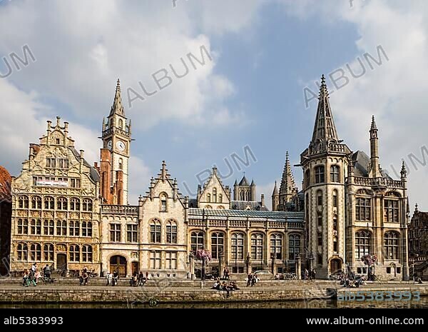 Old guild houses with St. Nicholas Church at the Lys or Leie river, on the right the historistic post office in neo-Gothic style, Graslei, Ghent, Flanders, Belgium, Europe.