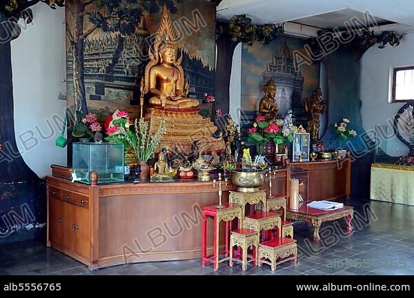 Buddha statue on an altar in a prayer room of the Buddhist monastery Brahma Vihara, Banjar, North Bali, Bali, Indonesia, Asia.