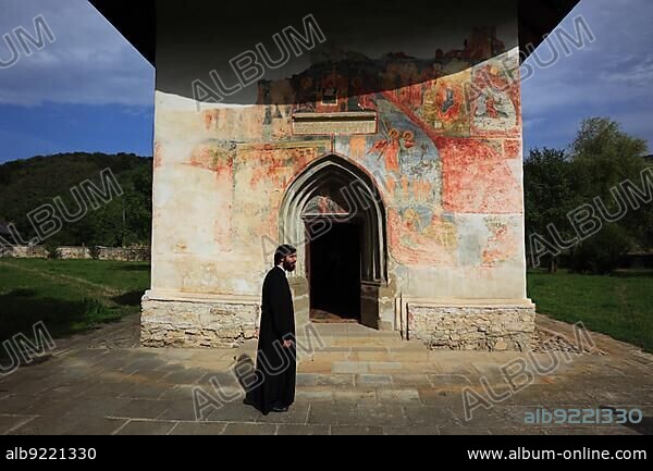 Moldavian Monasteries, Romania, The Holy Cross Church of Patrauti near Suceava, built in 1487, is the smallest church of Stephen the Great, fresco fragment of the Last Judgement on the west façade, Europe.