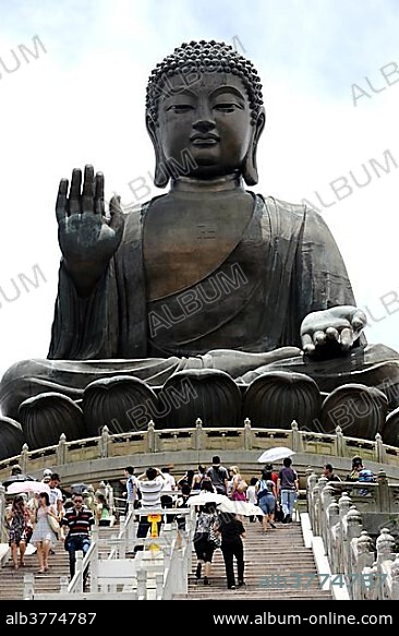 Tourists in front of Tian Tan Buddha or Big Buddha statue, Hong Kong, China, Asia.