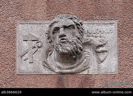 Relief of Vulcanus, roman god of fire and forge on a public building, Erlangen, Middle Franconia, Bavaria, Germany, Europe.