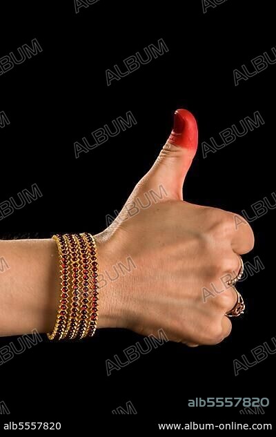Woman hand showing Shikhara hasta (hand gesture) (also called mudra) (meaning fist) of indian classic dance Bharata Natyam. Also used in Indian dances Odissi and Kuchipudi.