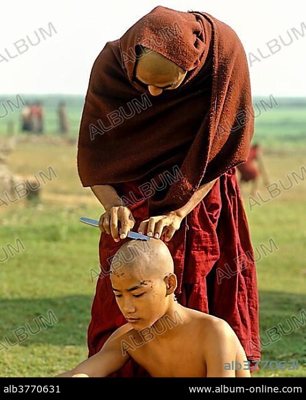Novice having his hair shaved, Amarapura, Mandalay Division, Myanmar, Burma, Asia.