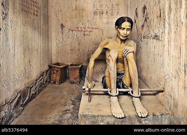 Prisoner, sculpture, in the "tiger cage" prison cell, war museum, Ho Chi Minh City, Saigon, Vietnam, Asia.