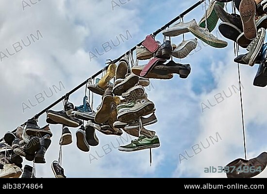 Shoes hanging from a wire, Letna Park, Prague, Czech Republic, Europe.