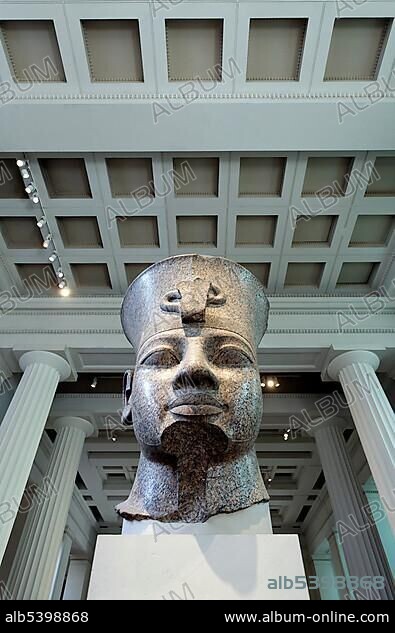 Head of the Egyptian king Amenhotep III from Thebes, monumental granite sculpture, British Museum, London, England, United Kingdom, Europe.