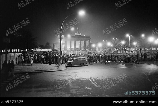 Fall of the Berlin Wall, on the night of the 9th November, 1989, a crowd gathered on the eastern side of the Brandenburg Gate, Berlin, Germany, Europe.