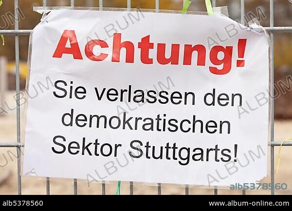 Protest poster "Achtung! Sie verlassen den demokratischen Sektor Stuttgarts!", German for "Caution! You are leaving Stuttgart's democratic sector!", protest against Stuttgart 21 railway project on a site fence, now in the Haus der Geschichte Baden-Wuerttemberg, museum, Schlossgarten, castle gardens, Stuttgart, Baden-Wuerttemberg, Germany, Europe.