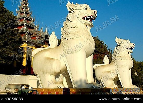 Huge figures of mythological lions Chinthe at the stairs to Mandalay Hill Burma.