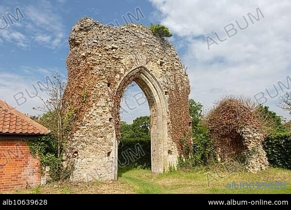 Ruined stone arch of abbey church, Butley priory, Suffolk, England, UK.
