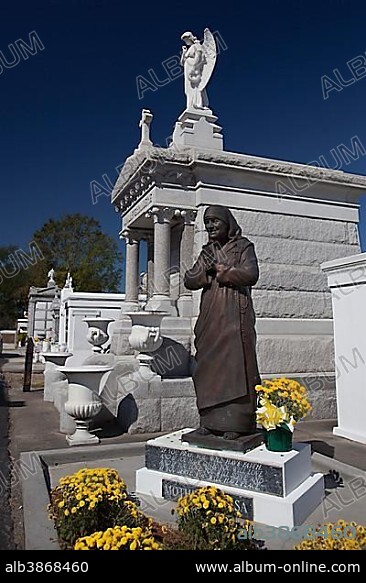 A statue of Mother Teresa in St. Louis #3 Cemetery, New Orleans, Louisiana, USA, North America.