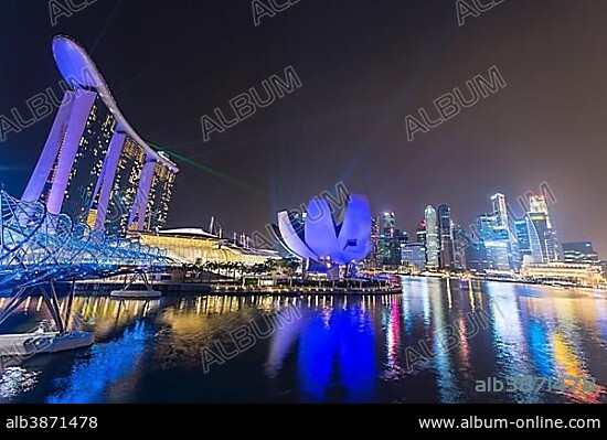 Light show, Millenium Bridge, Marina Bay Sands Hotel, Marina Bay, Museum of Science and Art, at night, Singapore, Asia.