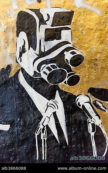 Man with camera for head, symbol of surveillance state of England, mass surveillance, CCTV, graffiti, London, England, United Kingdom, Europe.