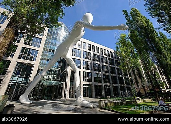 Walking Man sculpture by Jonathan Borofsky in front of insurance company Munich Re, Leopoldstrasse, Schwabing, Munich, Upper Bavaria, Bavaria, Germany, Europe.