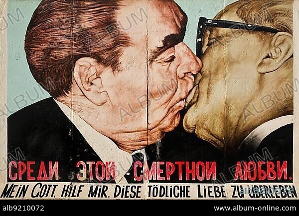 Brotherly Kiss, Brezhnev kisses Honecker, mural by Dmitri Vrubel on a remnant of the Berlin Wall, East Side Gallery, Berlin, Germany, Europe.