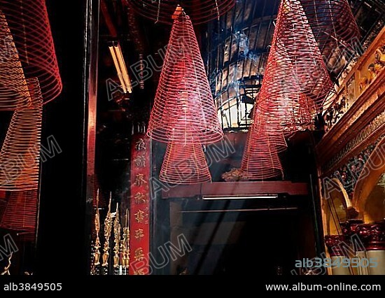 Red incense spirals at Phuoc An Hoi Quan Pagoda, Ho Chi Minh City, Saigon, Vietnam, Southeast Asia, Asia.