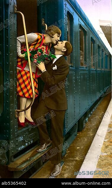 Historic photo, couple saying goodbye to each other at the train station, ca. 1920.