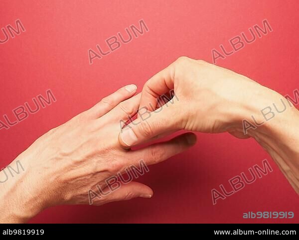 Hand position for mudra no. 2 in Jin Shin Jyutsu; alternative healing method or self-help concept; Asian medicine; awareness raising.