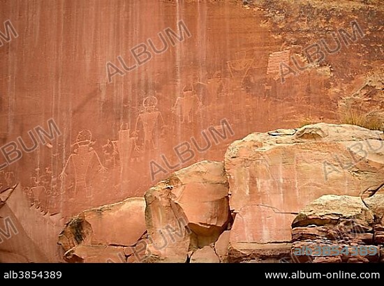 Petroglyphs etched in sandstone, symbols, mural paintings, depicting Fremont, Anasazi, Navajo and Anglo-Saxon cultures, prehistoric and historic rock art, Capitol Reef National Park, Utah, Southwestern USA.