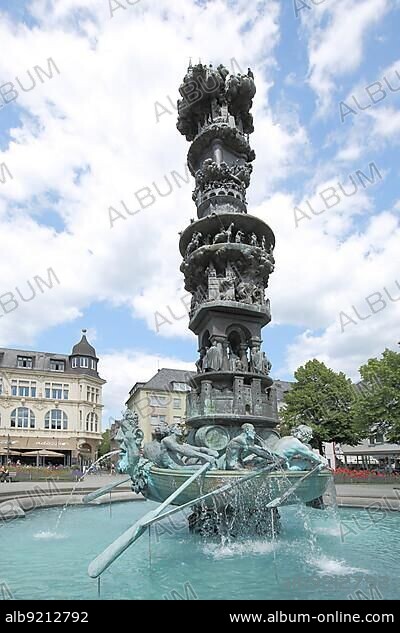 Fountain with sculptures and figures, rowing boat with oarsman and history column, obelisk, Görresplatz, Old Town, Koblenz, Rhineland-Palatinate, Upper Middle Rhine Valley, Germany, Europe.