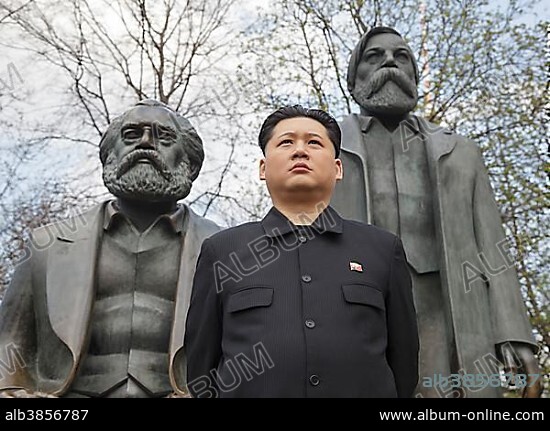 Kim Jong-un impersonator, Howard X from Hong Kong, standing in front of the Marx and Engels Statue, Marx-Engels-Forum, Berlin, Germany, Europe.