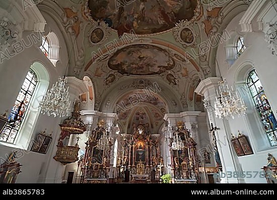 Church interior with the altar of the baroque church of St. Jacob and St. Leonard, Hopfgarten im Thale, Brixental, Tyrol, Austria, Europe.