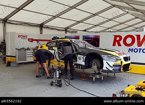 Mechanics work in pit, pit lane on DTM race car, German Torenwagen Masters of racing driver Timo Glock, Rowe Racing BMW M6 GT3, Norisring, city circuit, temporary car race track, Dutzendteich, former Nazi Party Rally Grounds, Nuremberg, Middle Franconia, Franconia, Bavaria, Germany, Europe.