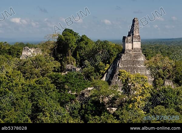 Mayan ruins of Tikal - view from Temple III to Temple I, Temple of the Giant Jaguar, Yucatan, Guatemala, Central America.