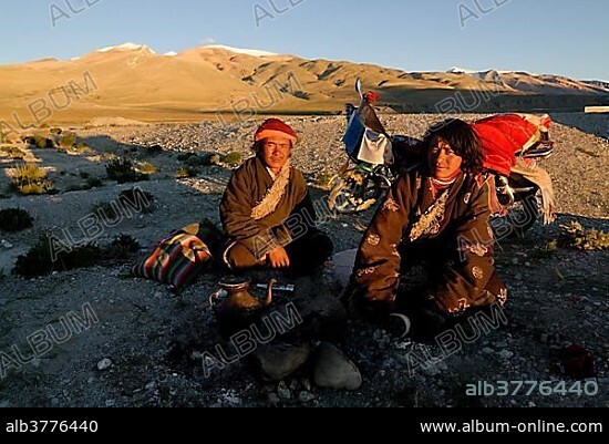 Tibetan pilgrims with decorated and packed bikes on their way to Mount Kailash, Changtang high plateau at the Lungkar mountains, Western Tibet, Ngari Province, Tibet, China, Asia.