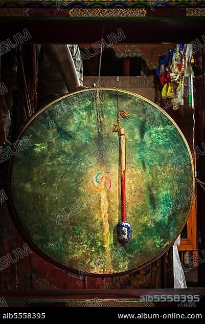 Large tibetan drum with beater in Hemis gompa (Tibetan Buddhist monastery) . Ladakh, India, Asia.