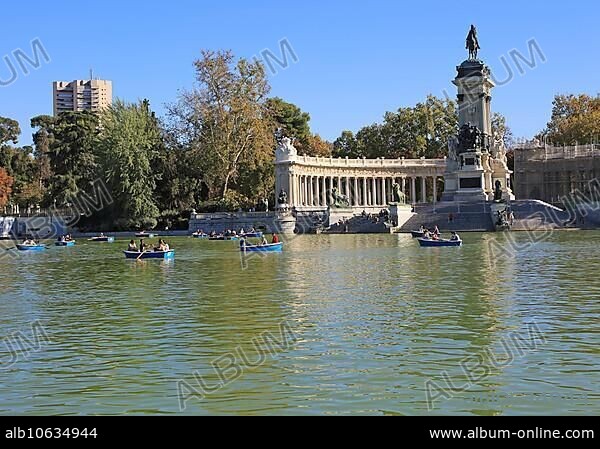 Rowing boats in boating pond of Estanque, El Retiro park, Madrid, Spain, monument to King Alfonso XII, Europe.