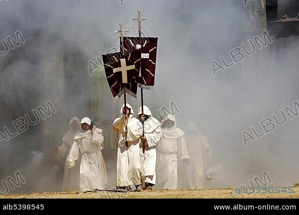 Monks in white cowls carries red flags with cross are befog, knight festival Kaltenberger Ritterspiele, Kaltenberg, Upper Bavaria, Germany