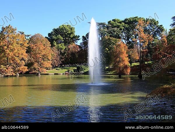 Water fountain in pond lake by Crystal Palace, El Retiro park, Madrid, Spain, Europe.