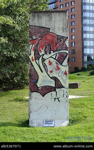 A piece of the Berlin wall in front of the Portobello-Haus building, Duesseldorf, North Rhine-Westphalia, Germany, Europe.