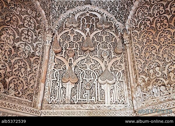 Stucco decorated ceiling of Mihrab (praying alcove), Medersa Ali-Ben-Youssef, Medina, Marrakech, Morocco, Africa.