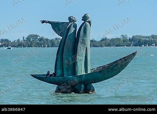 Bronze monument to Dante, 2007, standing in boat, Vergil pointing towards cemetery island San Michele, Russian sculptor George Frangulyan, Venetian Lagoon, Veneto, Italy, Europe.
